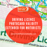 A UK driving licence photocard and roadmap.